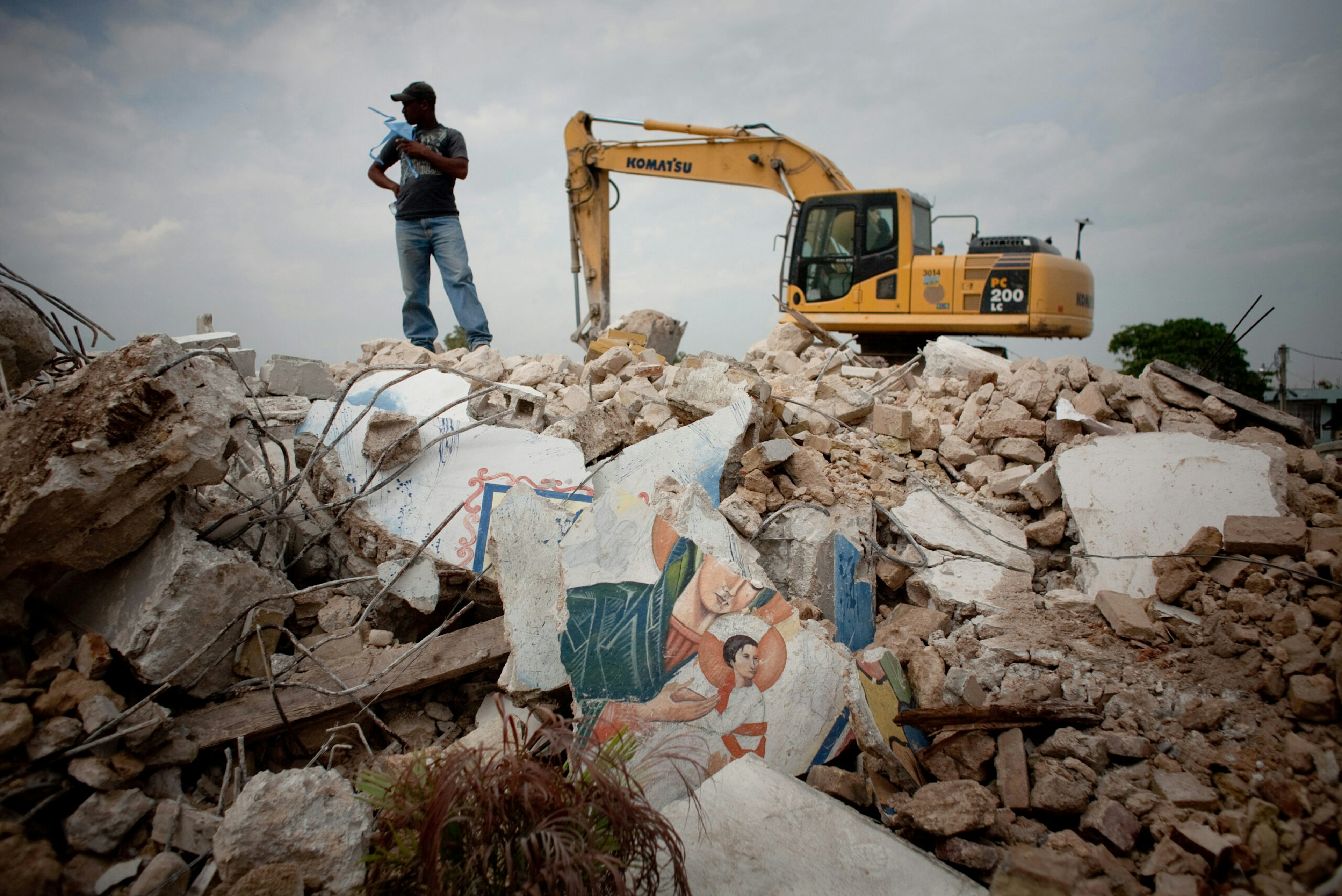 A man stands on the rubble of Notre Dame du Perpetuel Secours Catholic church in Port-au-Prince, Haiti, Feb. 27, 2010.