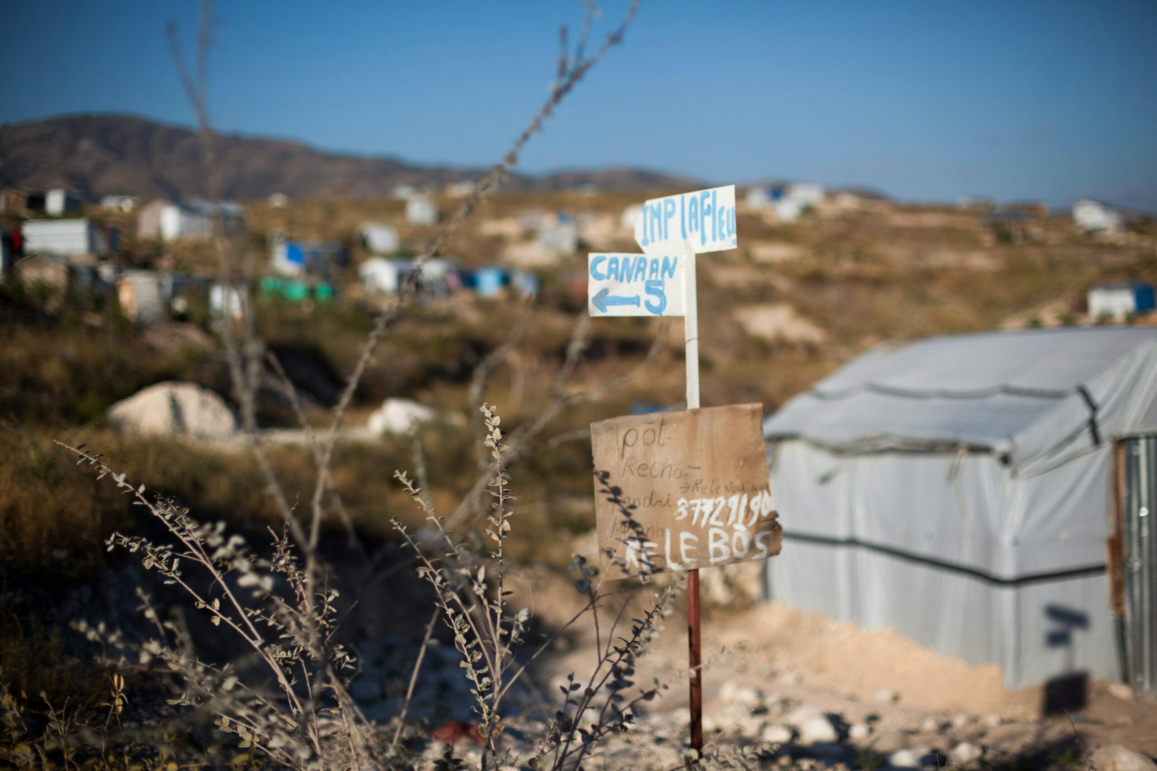 A handmade sign directs visitors within the Canaan settlement outside Port-au-Prince, Haiti.