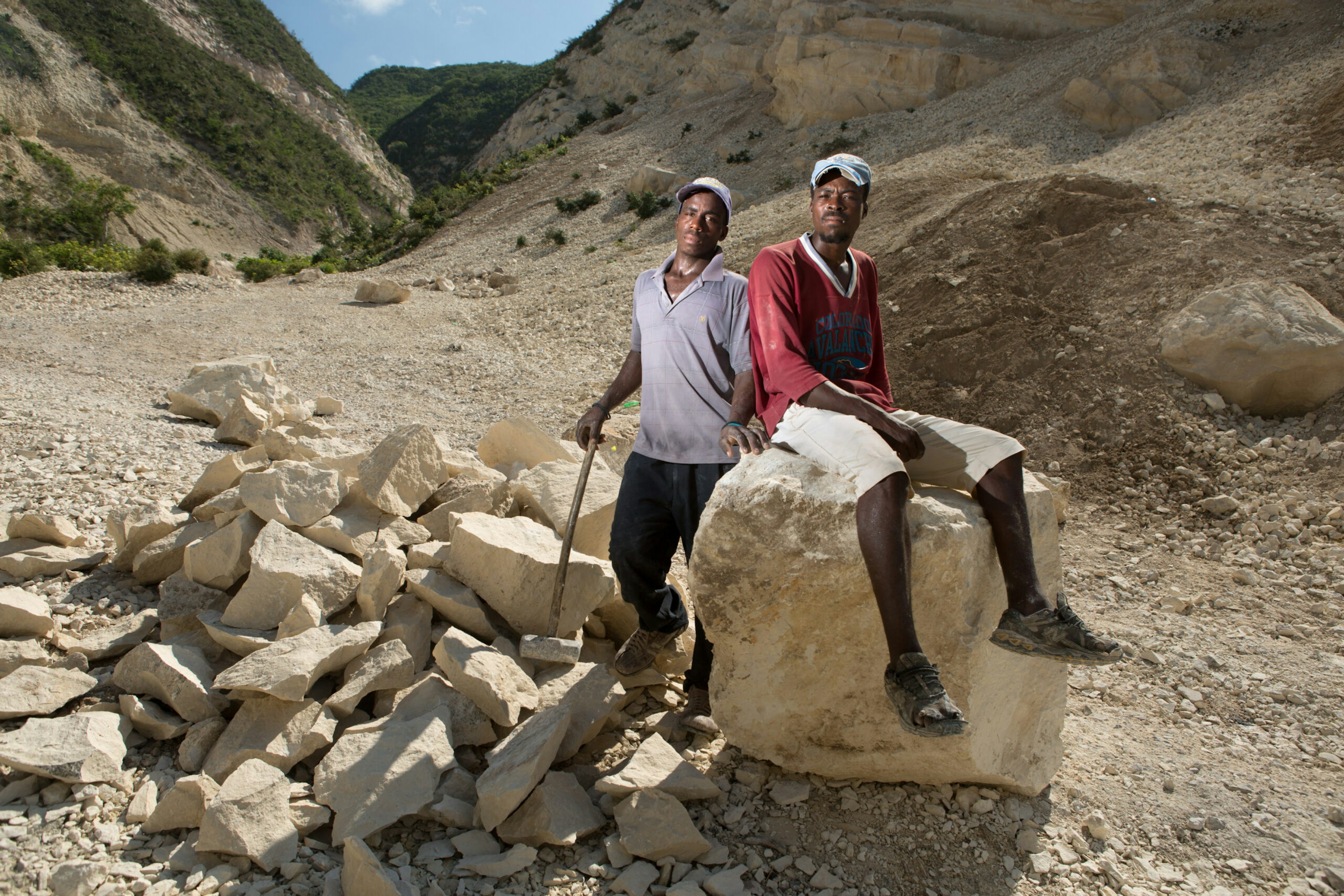 Brandy Harry, left, and Jaleus Wadner pose near a mountainside near their homes in the Onaville neighborhood of Canaan.