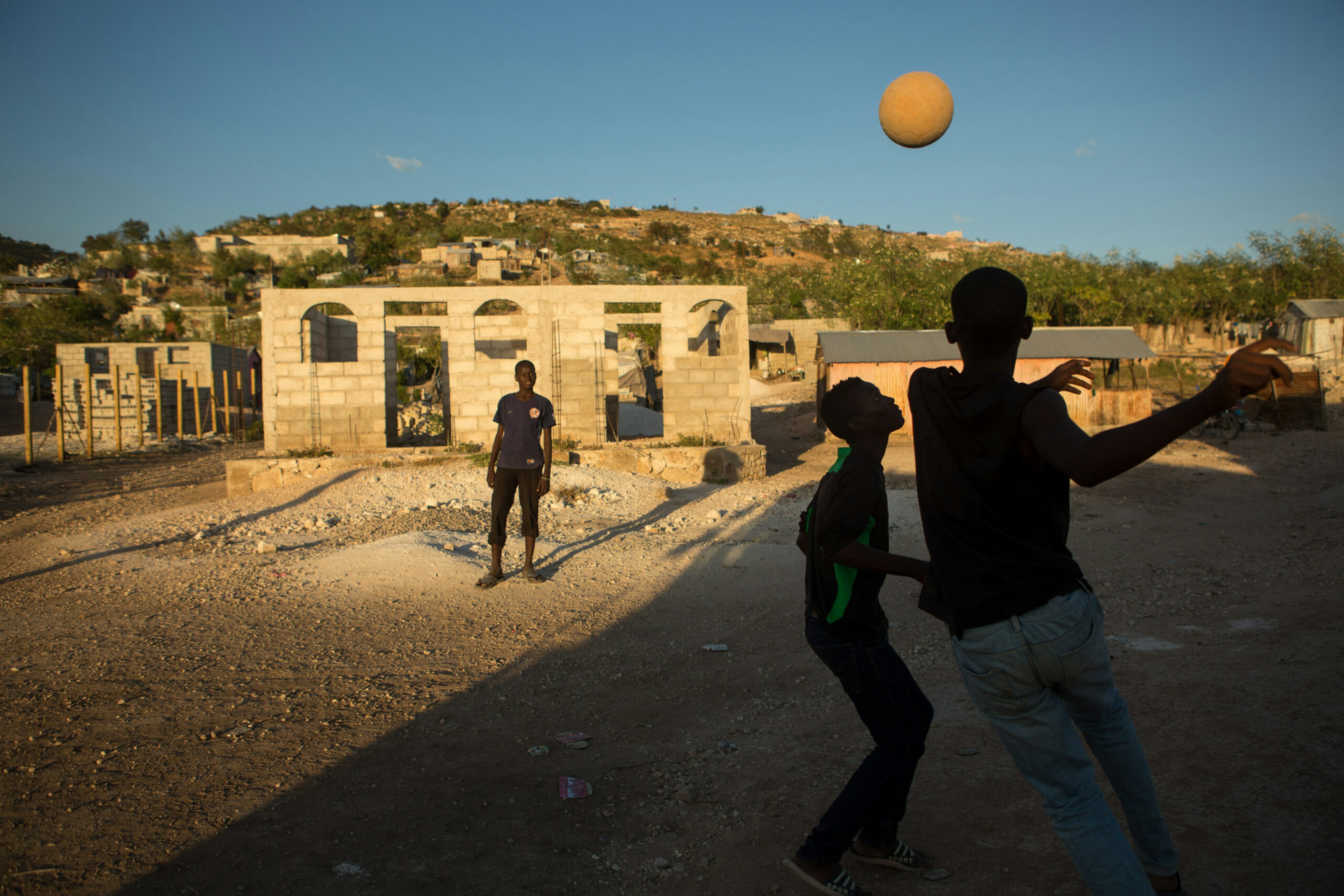 Boys play ball in the community soccer field in Canaan, Jan. 6, 2015.