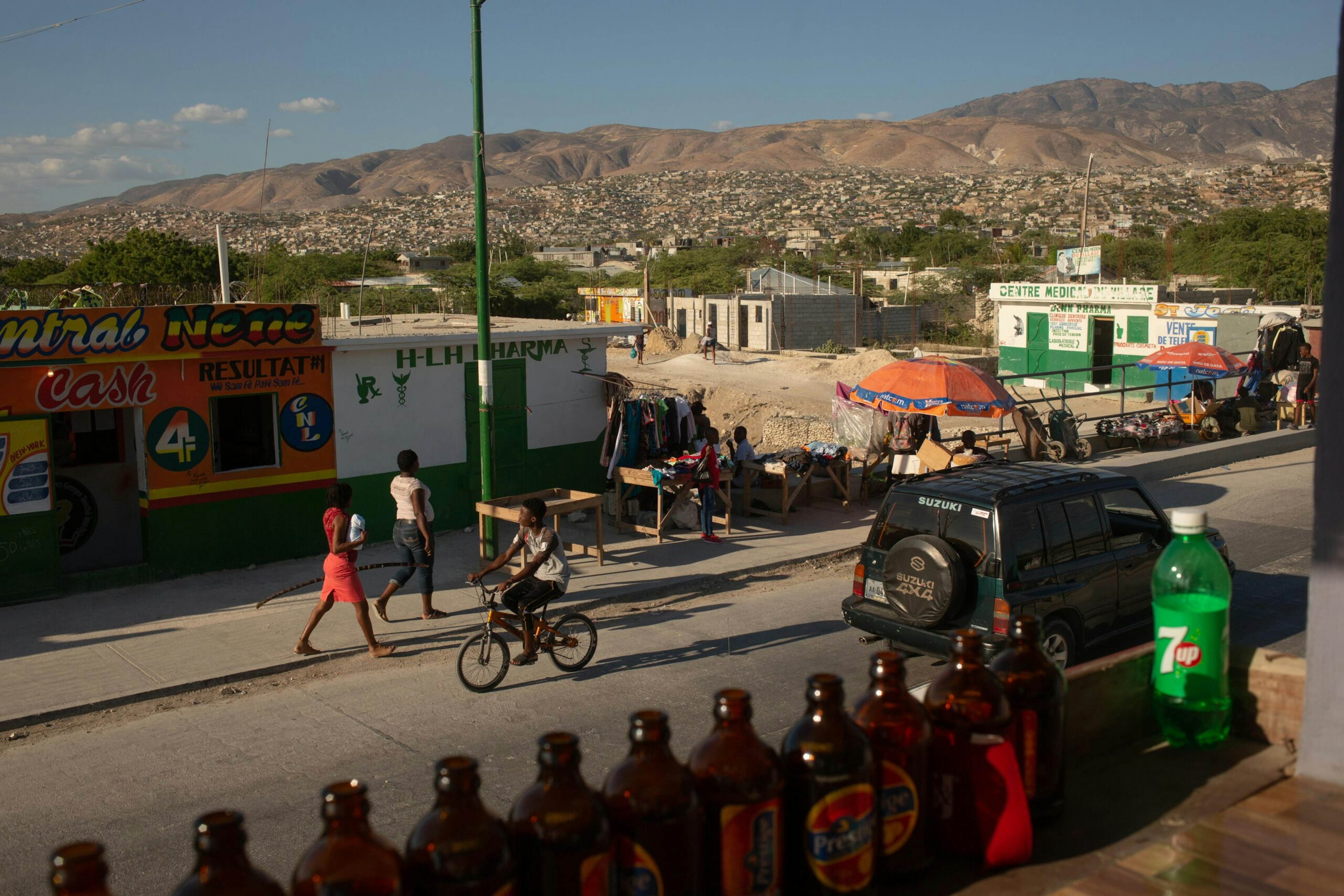 Traffic flows along the first paved road to the Canaan settlement outside Port-au-Prince, Haiti, Jan. 5, 2019.