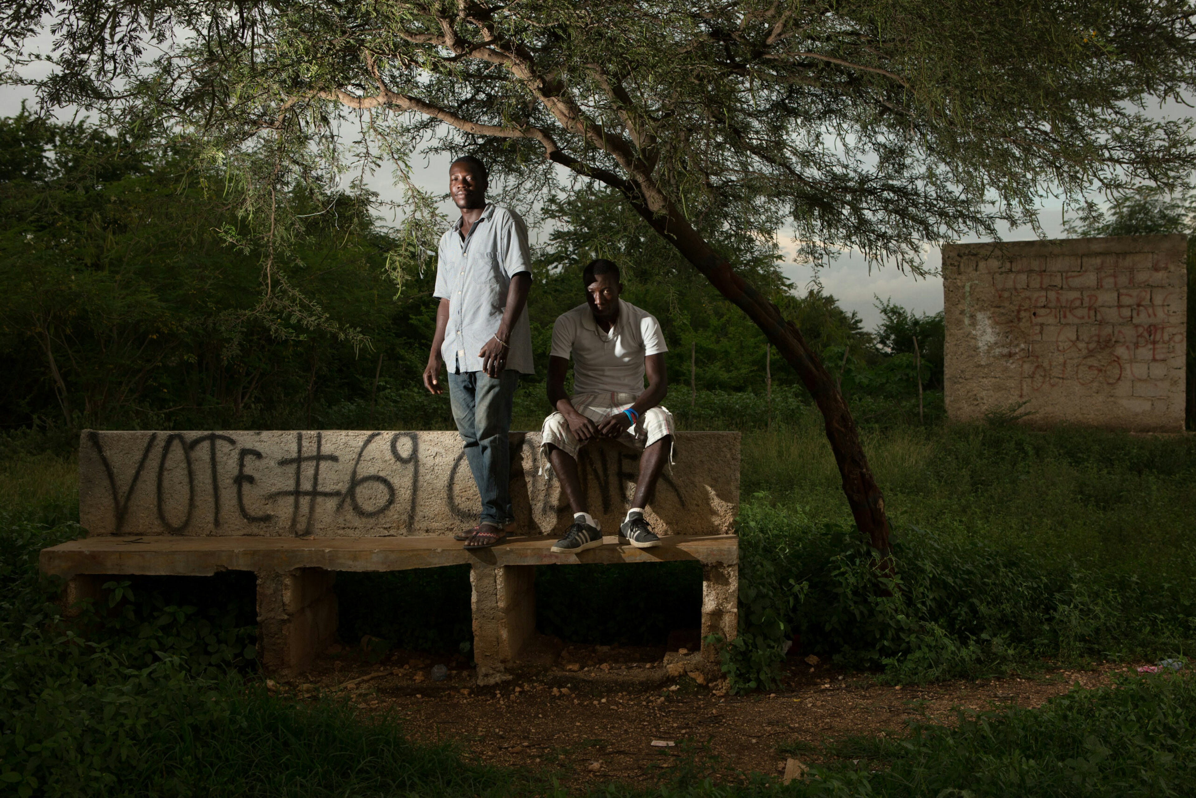 Evenson Louis, left, president of the community organization OPRDS, and friend Accene Appolon stand in a park they helped preserve in Canaan, May 11, 2016.