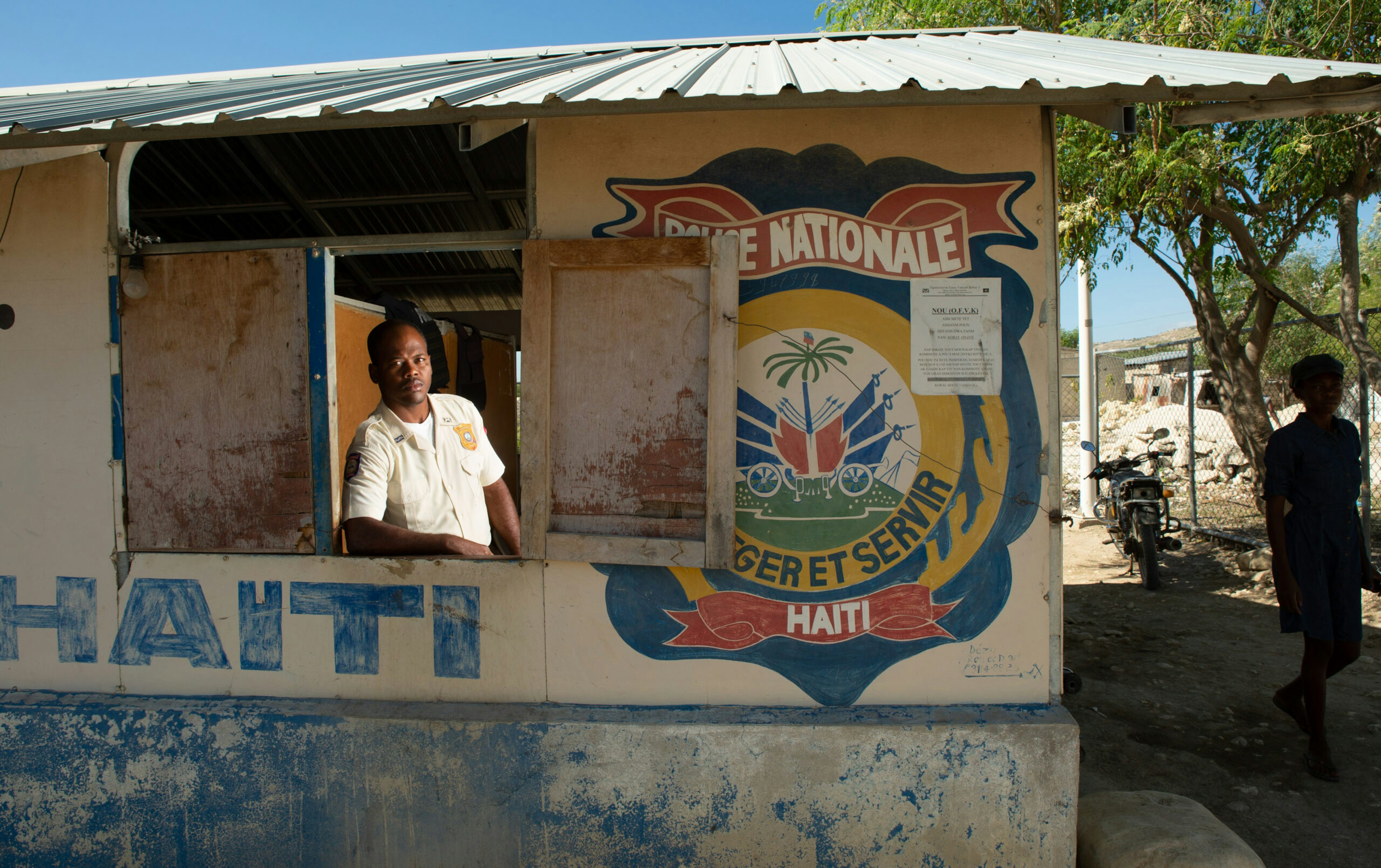 Haitian National Police Officer Michelet Faldony, 38, poses for a photo inside one of the only police posts in the Onaville section of the Canaan settlement outside Port-au-Prince, Haiti, Dec. 14, 2019.